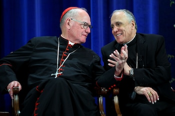 Los cardenales Timothy Dolan y
